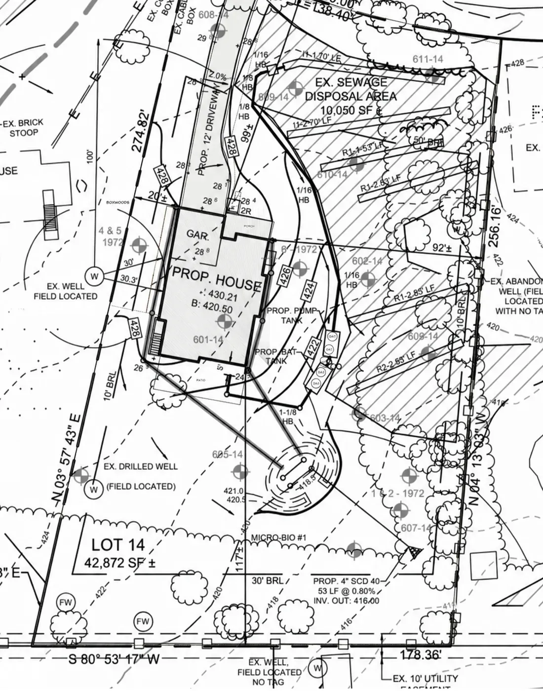 The builder's survey for the property: house and garage footprint, driveway, setback lines, grade contours, a well, and the septic reserve field.